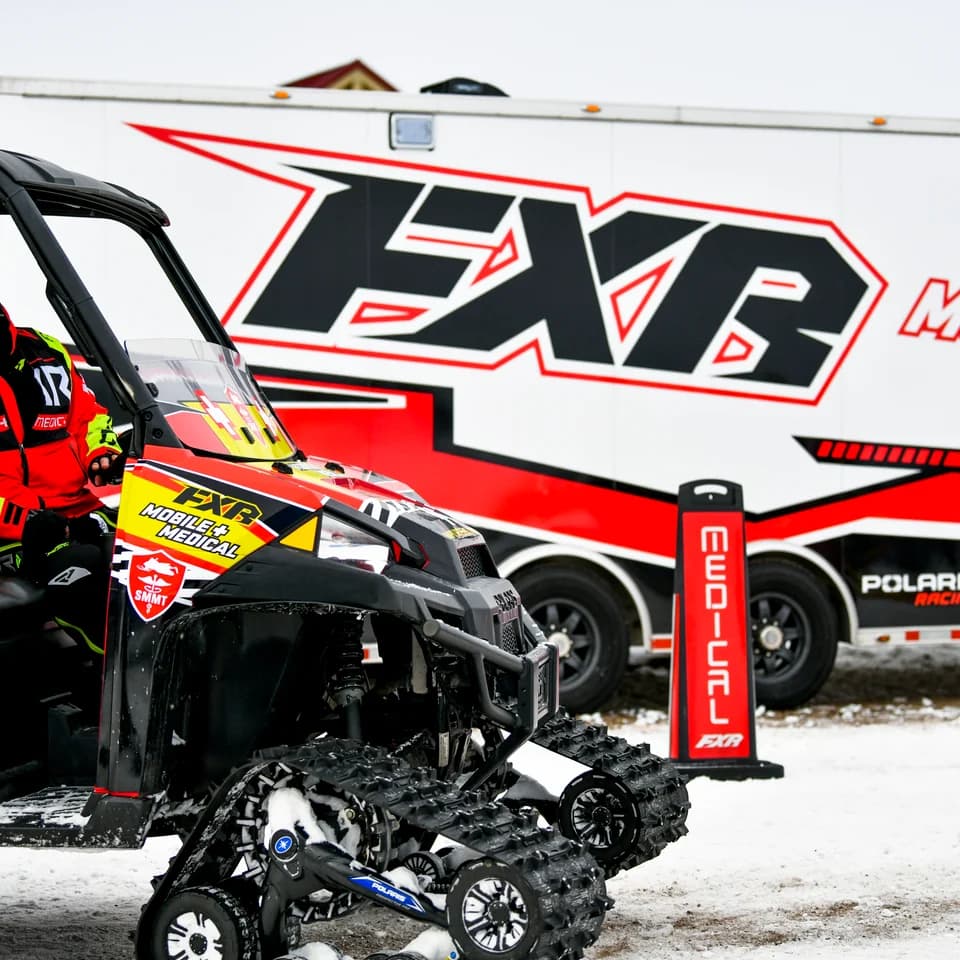FXR medical side-by-side parked beside the team trailer